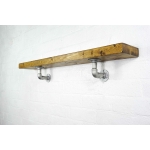 Stainless steel industrial pipe shelving brackets with reclaimed wood scaffolding board shelf