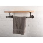 reclaimed wooden shelf with industrial steel pipe brackets and clothes rail