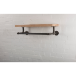 reclaimed wooden shelf with industrial steel pipe brackets and clothes rail