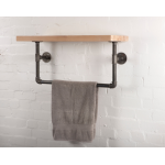 reclaimed wooden shelf with industrial steel pipe brackets and clothes rail