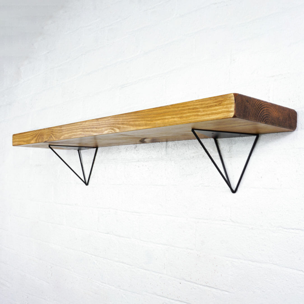 Black steel hairpin shelf brackets with reclaimed wooden shelf