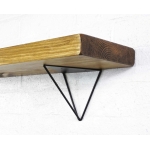 Black steel hairpin shelf brackets with reclaimed wooden shelf