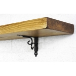 decorative black steel shelf brackets with reclaimed wooden shelf