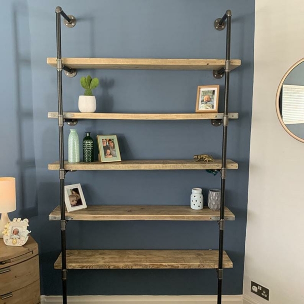 Wall mounted industrial pipe shelving unit with reclaimed wood shelves