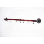 red industrial pipe curtain pole with raw steel fixings and curtain hooks