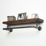 raw steel industrial pipe shelf with elbows, hanging rail and dark wood reclaimed shelf