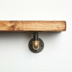 raw steel industrial pipe shelf brackets with brass elbows pair