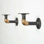 raw steel industrial pipe shelf brackets with brass elbows pair